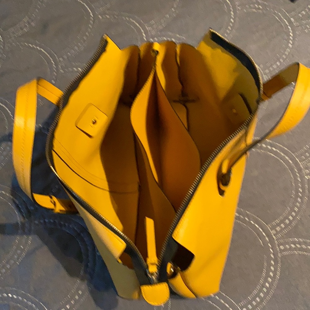 Mustard handbag very spacey with black strap